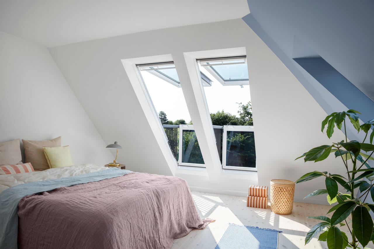 Bedroom with two roof balcony windows
