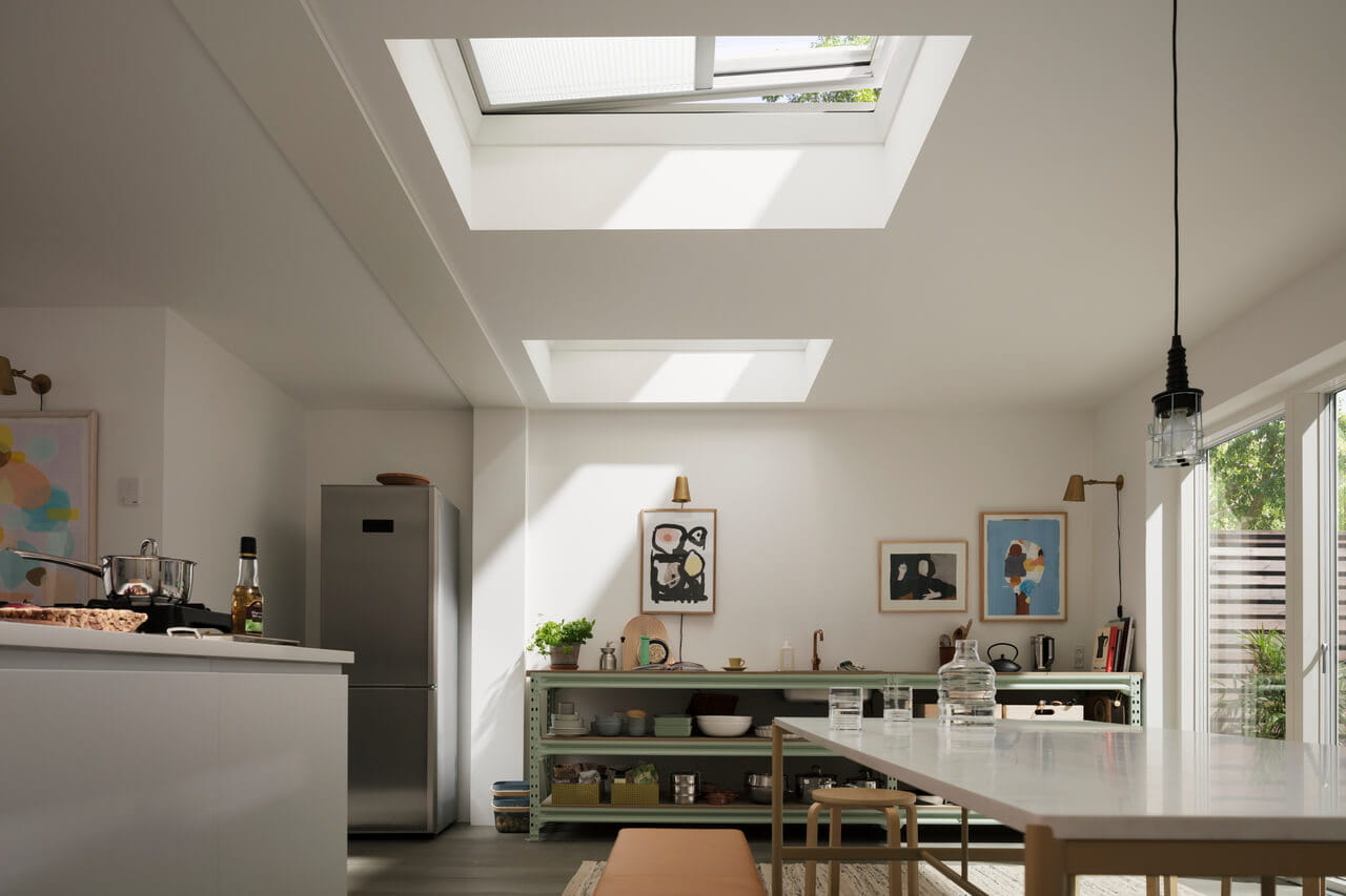 A spacious kitchen and dining area with flat roof windows