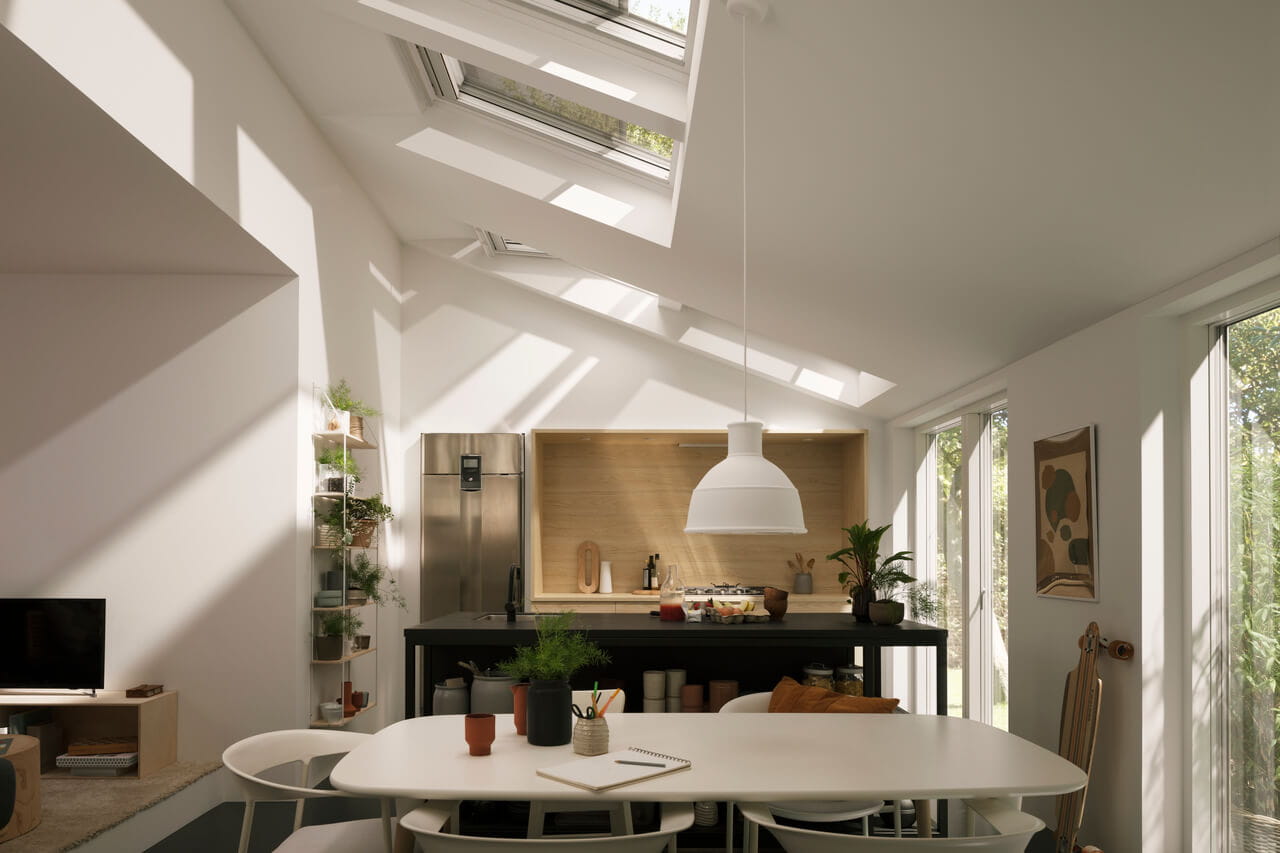 A big bright kitchen filled with light from VELUX 3in1 roof windows