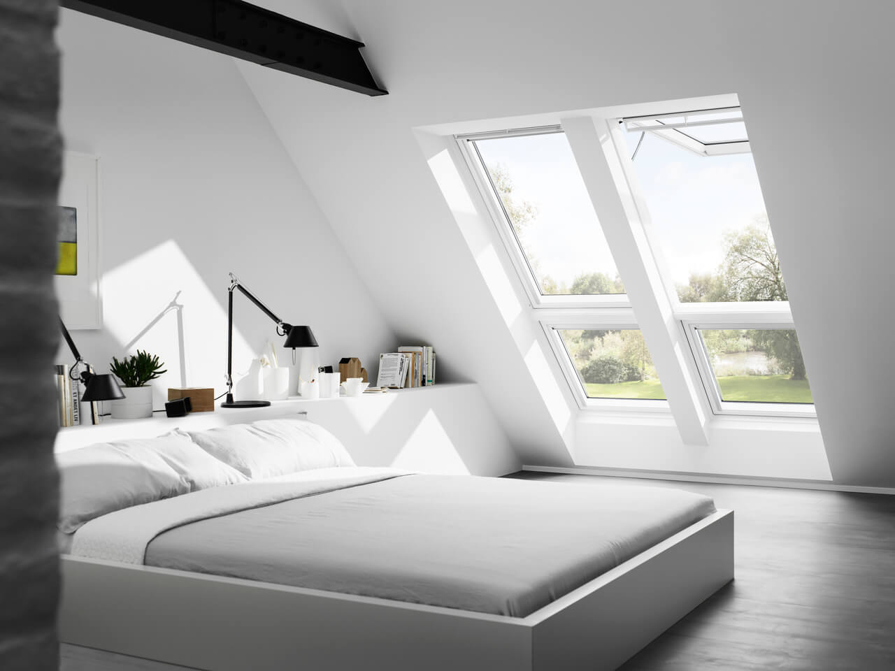 Bright white painted bedroom with two roof windows
