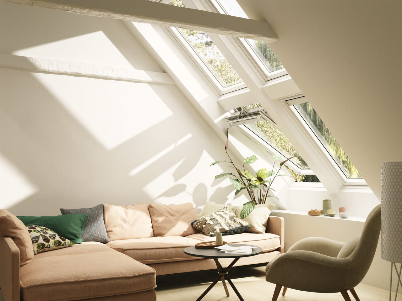 Bright and cozy living room area with roof windows.