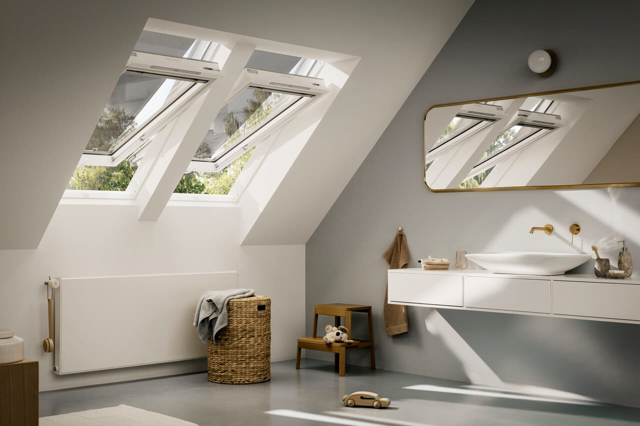 Grey walled bathroom image with 2 opened VELUX roof windows and anti-heat blinds