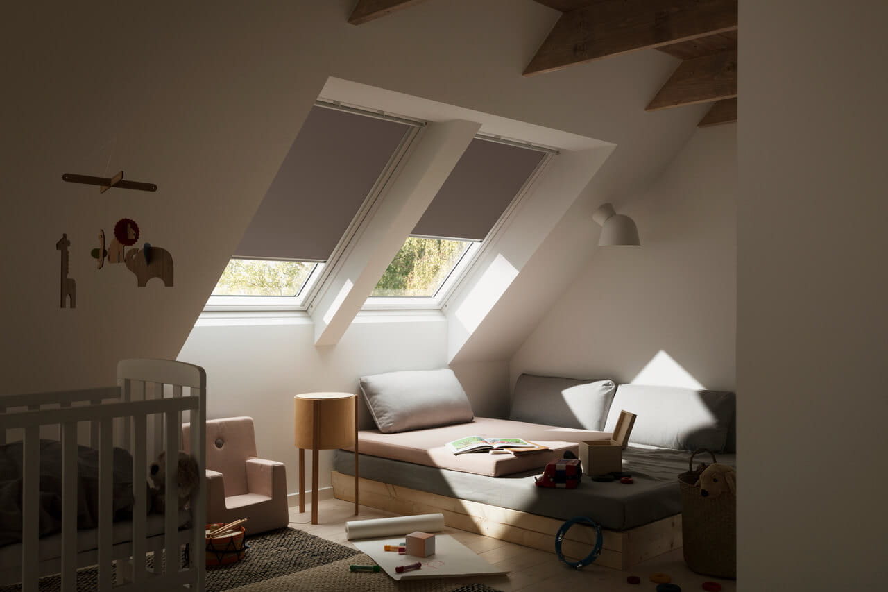 Baby room image where VELUX blackout blinds are ideal for keeping the light out.