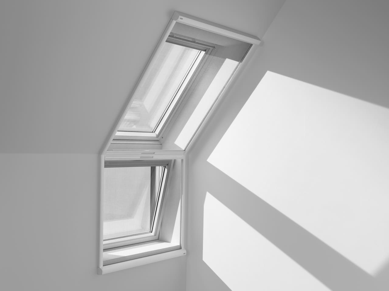 Image of VELUX roof window and extension with insect-screen to keep out bugs.