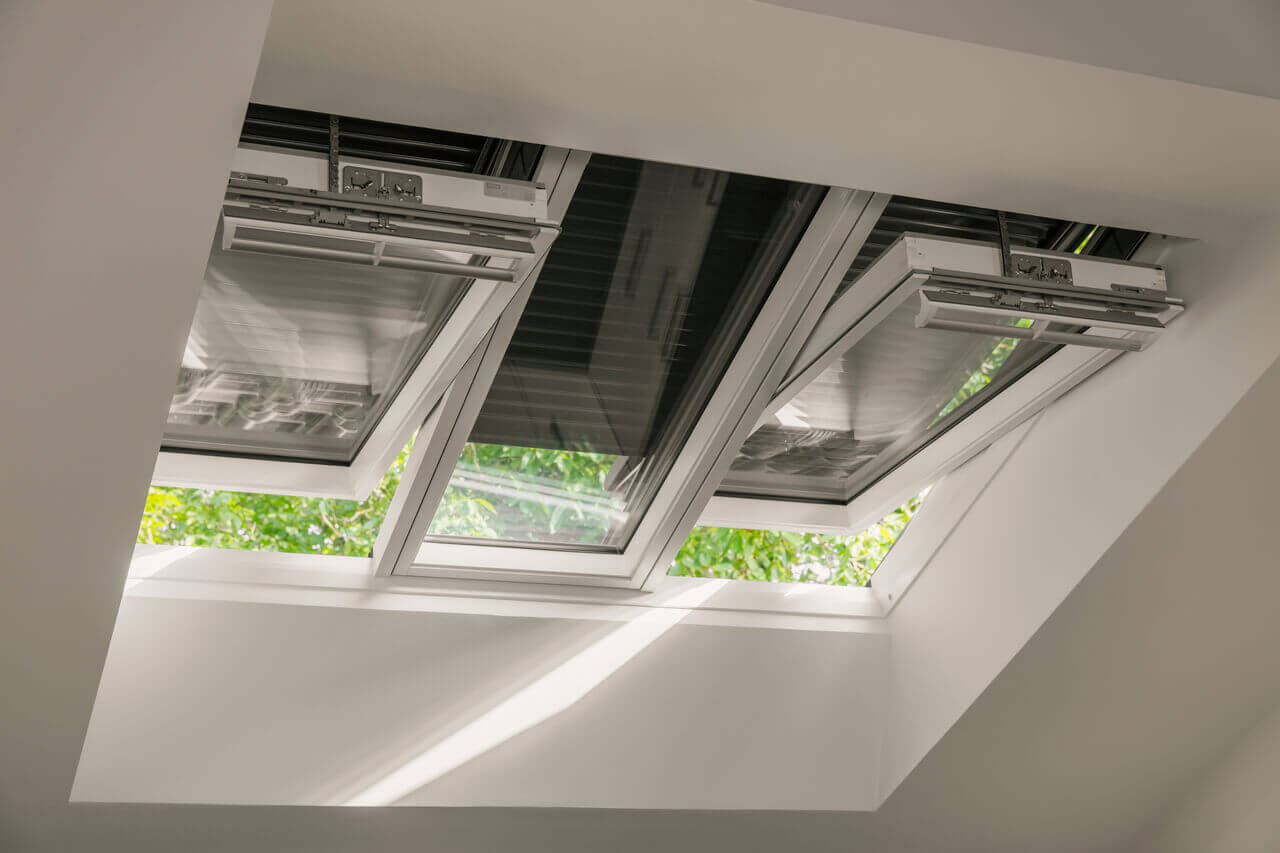 Close-up of a VELUX 3in1 window with roller shutters installed