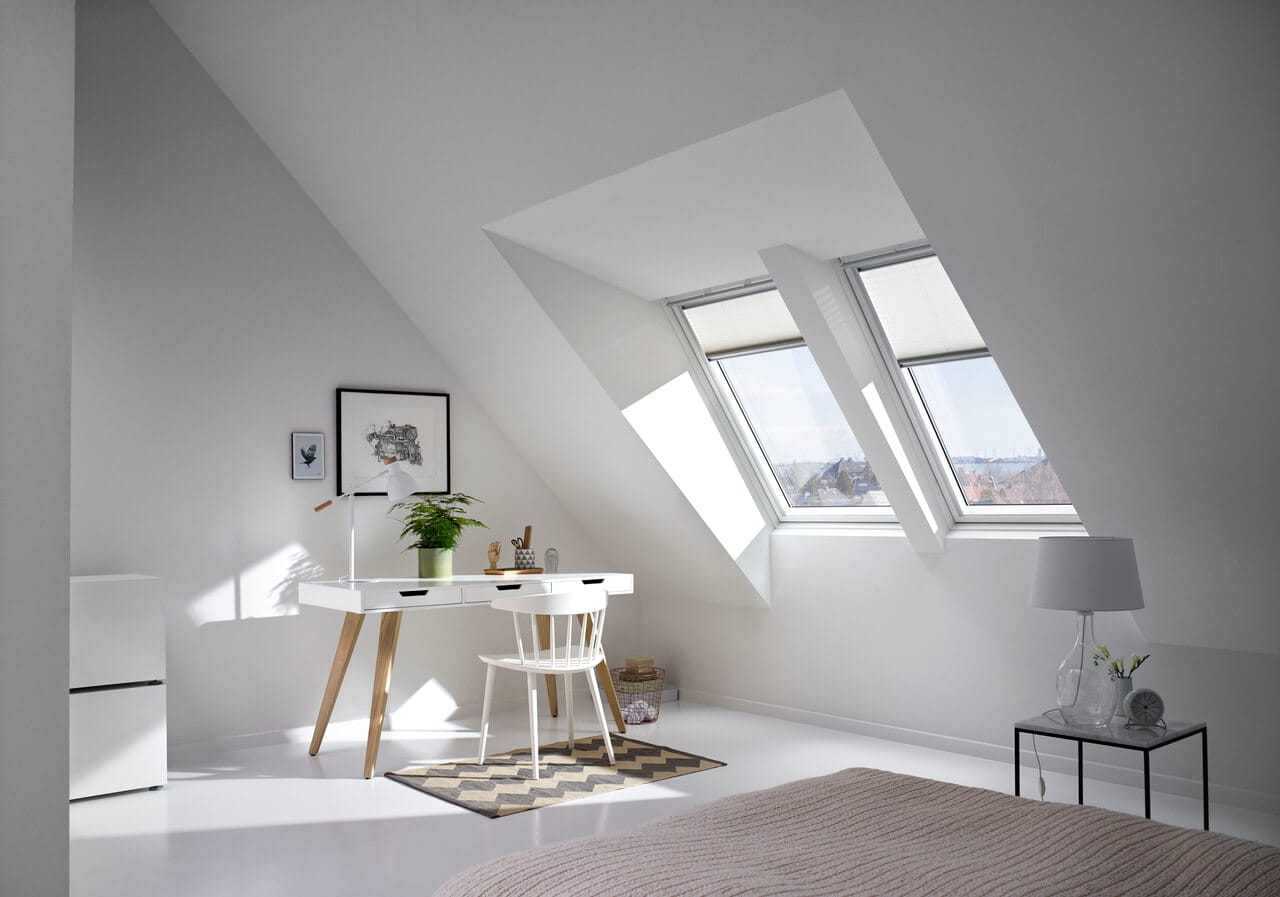 Two VELUX roof windows with translucent pleated blinds installed in a study