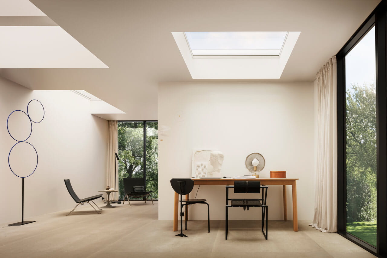 VELUX curved glass rooflight over a writing table and corridor
