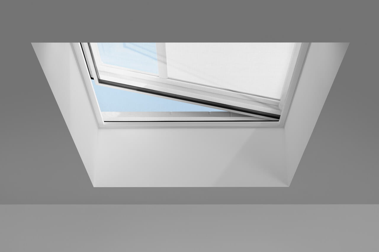 A VELUX flat glass rooflight with anti-heat blind seen from the inside
