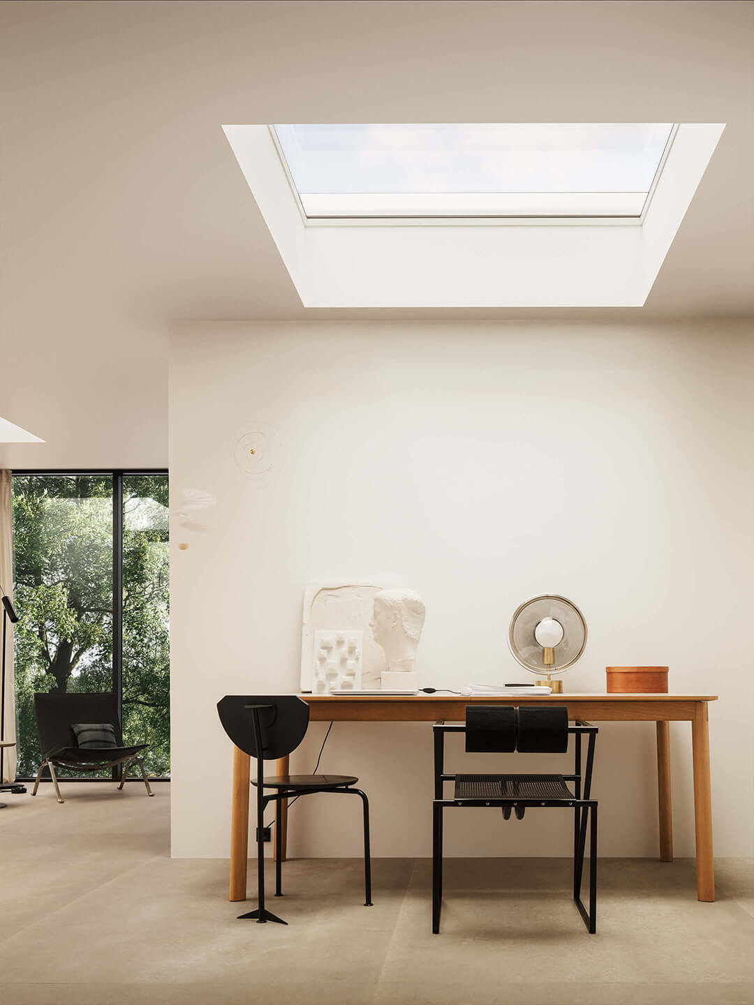 VELUX flat glass rooflight installed above a writing table
