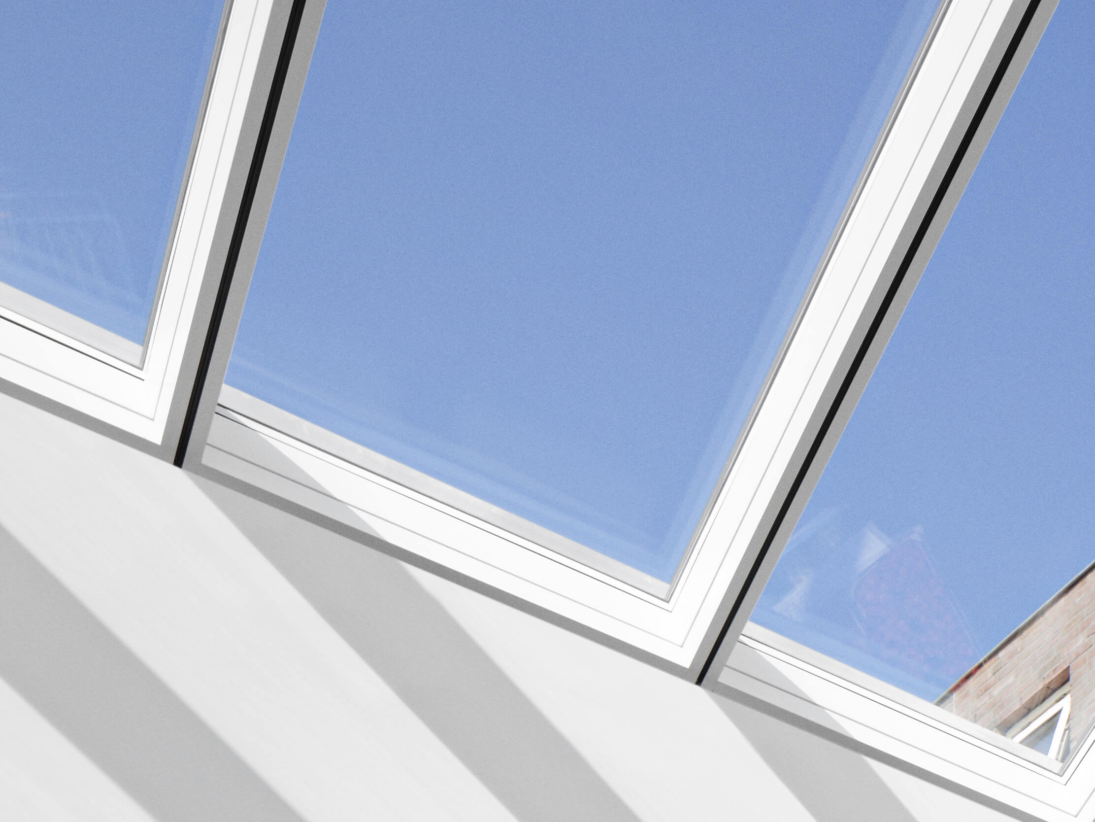 close up of VELUX modular skylights showing slim profiles between modules