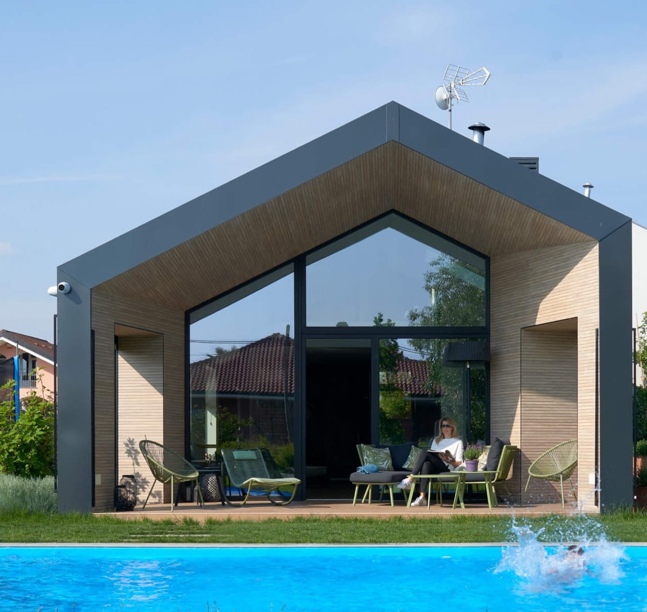 A front view of a new modern house with swimming pool