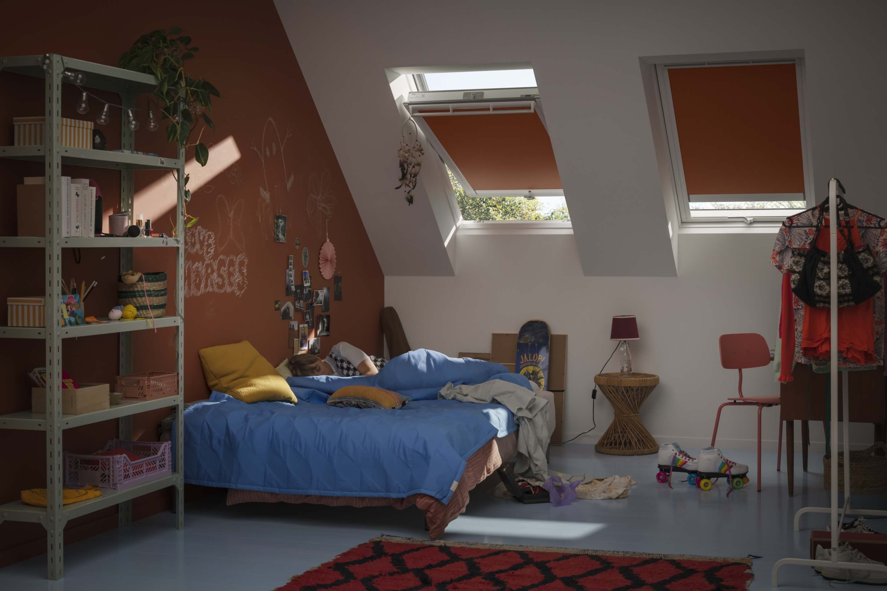 Kids room with big bed and many toys darkened with VELUX blinds