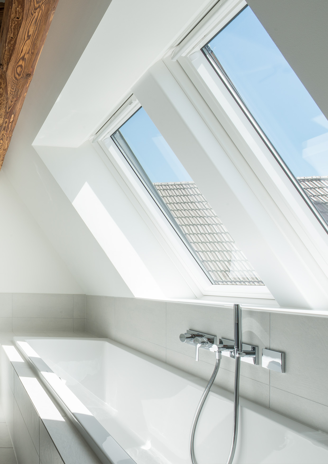Sunny bathroom with two roof windows