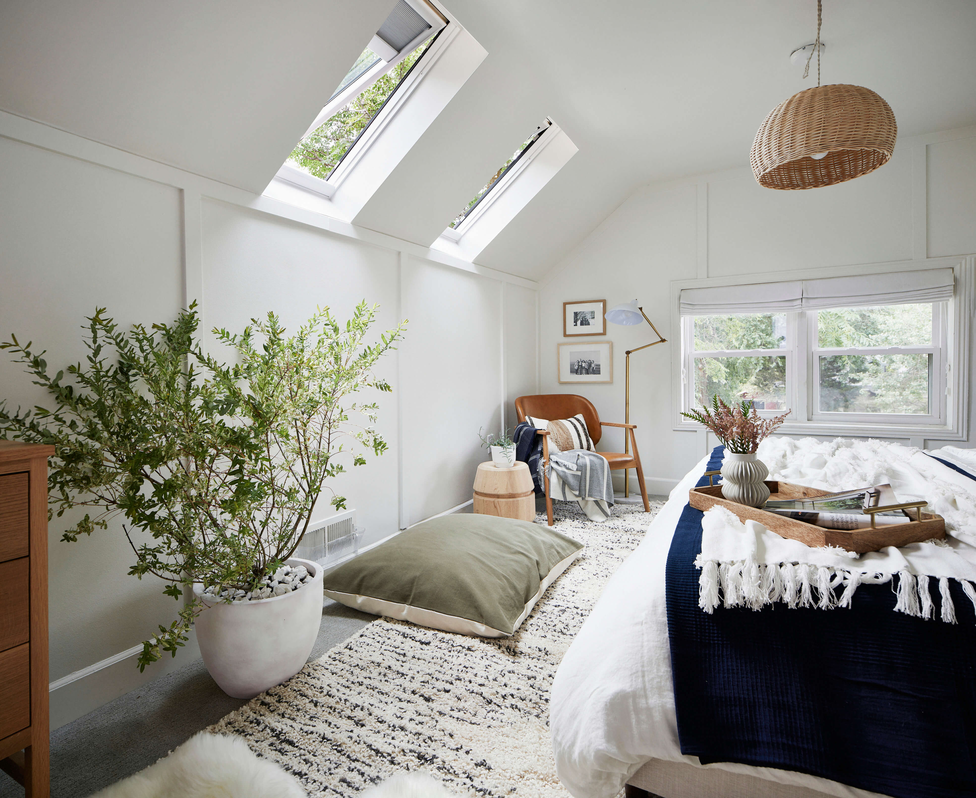 A bright bedroom space with two roof windows