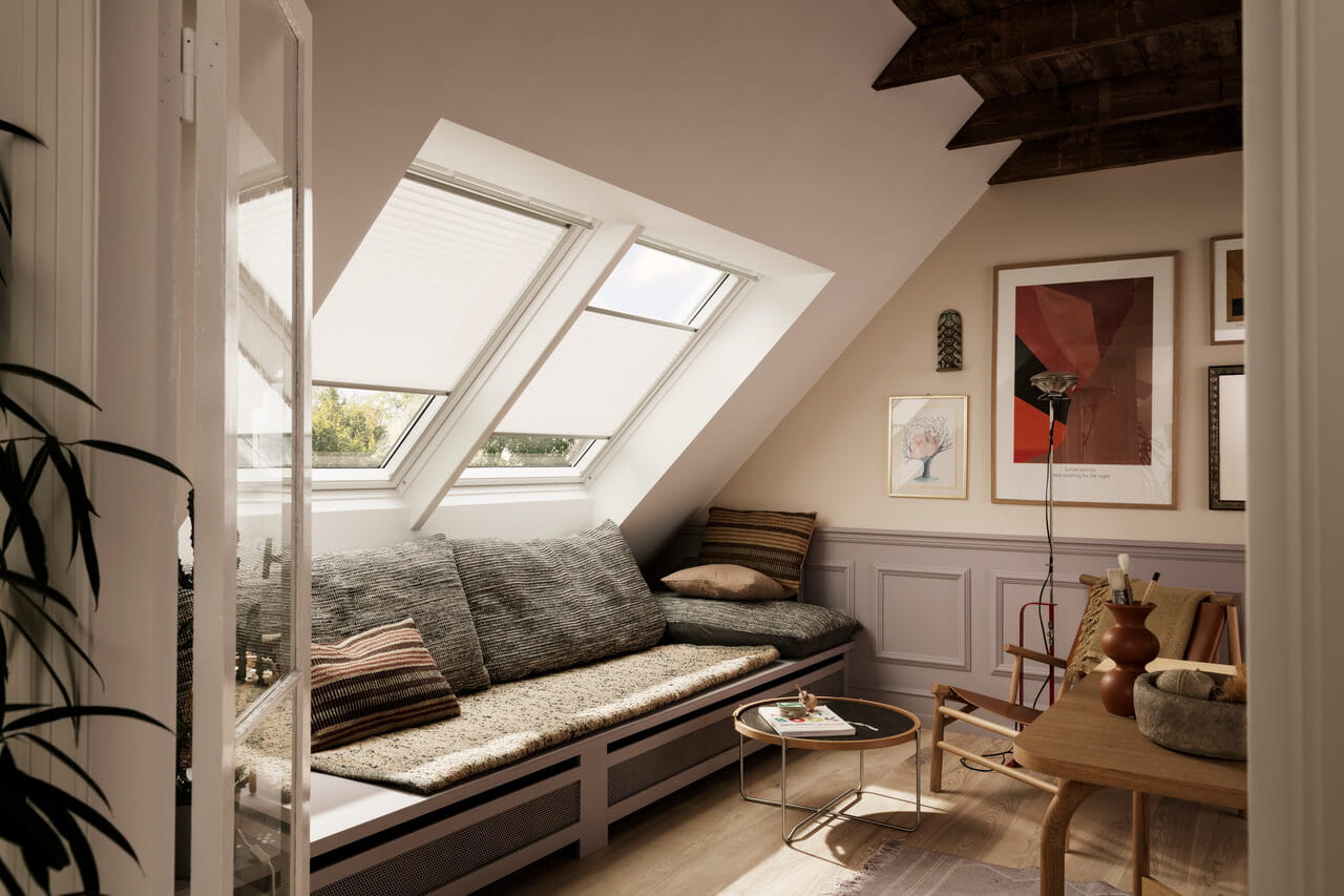 Living room in the attic with wooden furniture an light coming through the roof window