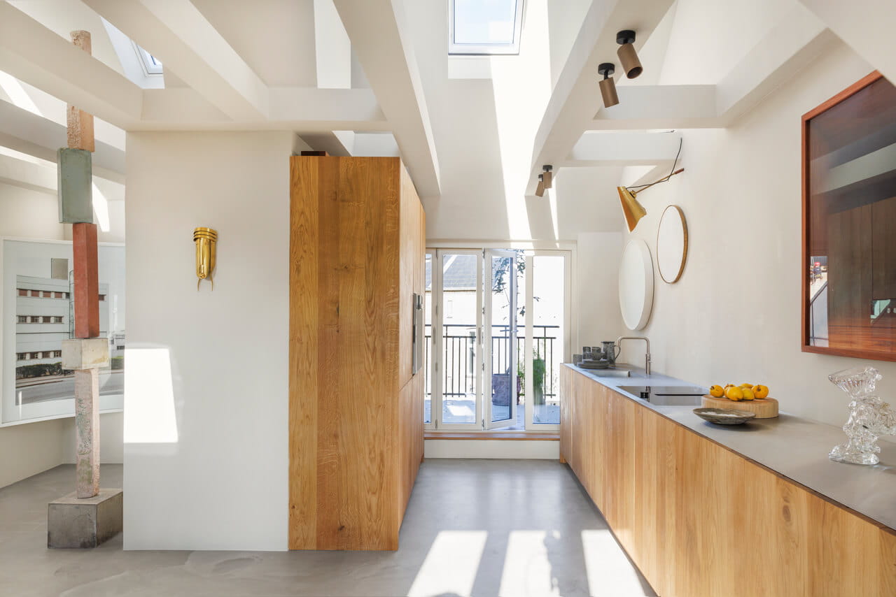 Bright and sunny kitchen in the white painted house.