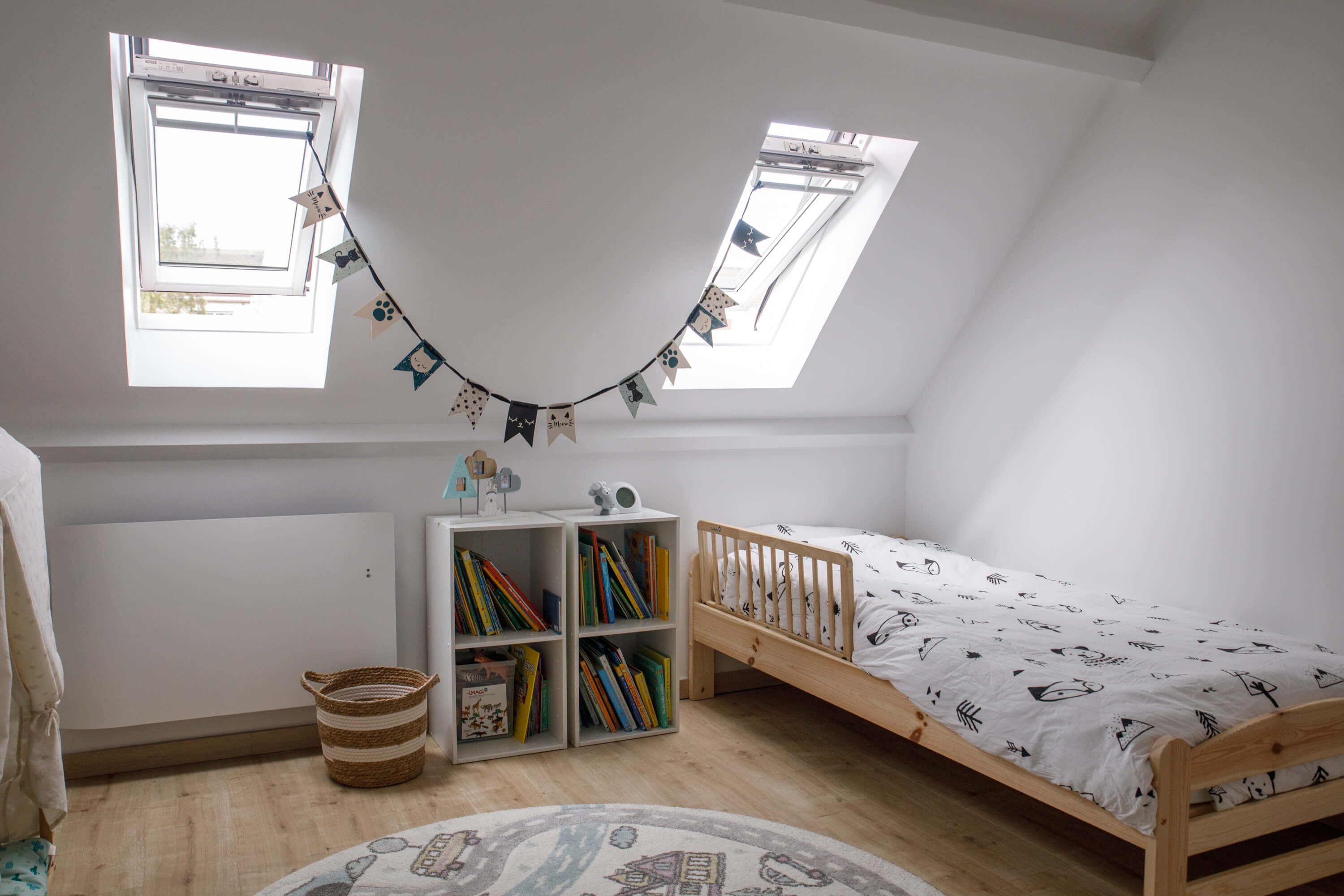 A bright kids room with two roof windows