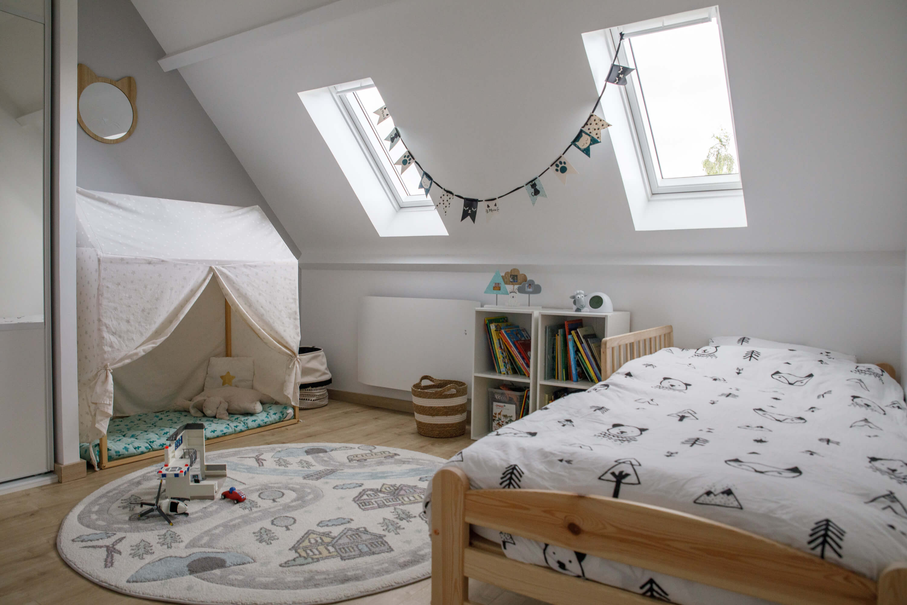 A bright kids room with two roof windows