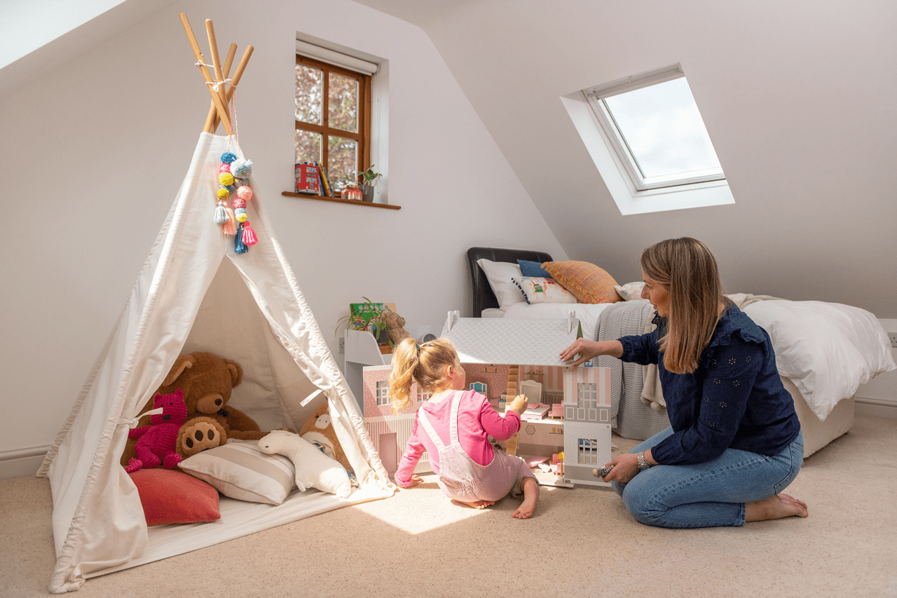 Designing an energy-efficient living space with roof windows-mother and child playing