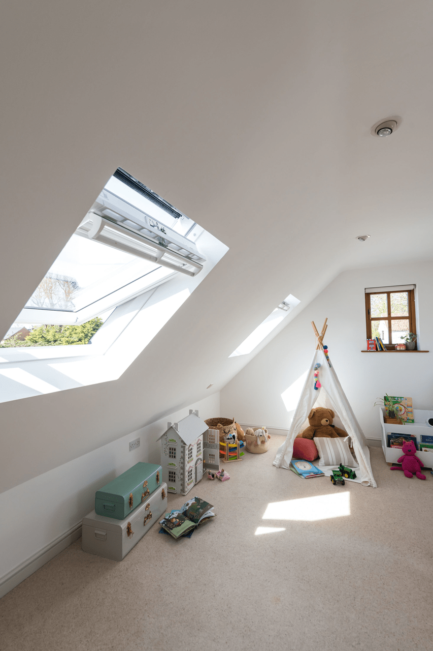 Designing an energy-efficient living space with roof windows - room with open window