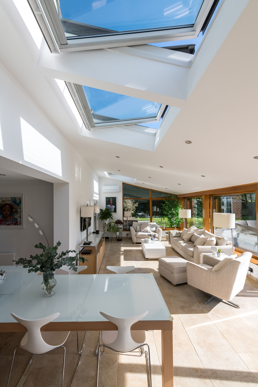Designing an energy-efficient living space with roof windows-room with roof windows open