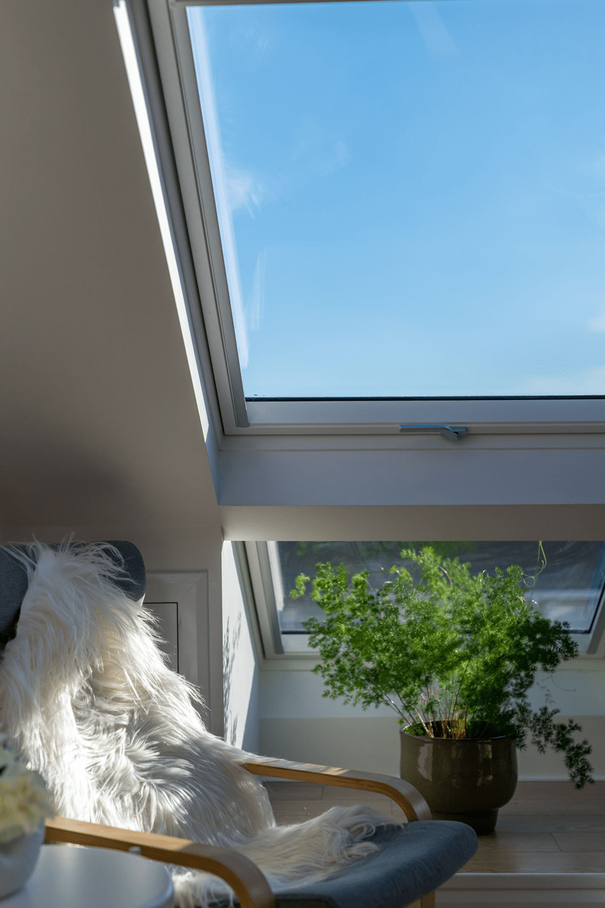How to realise the potential of your attic space with roof windows - chair by window