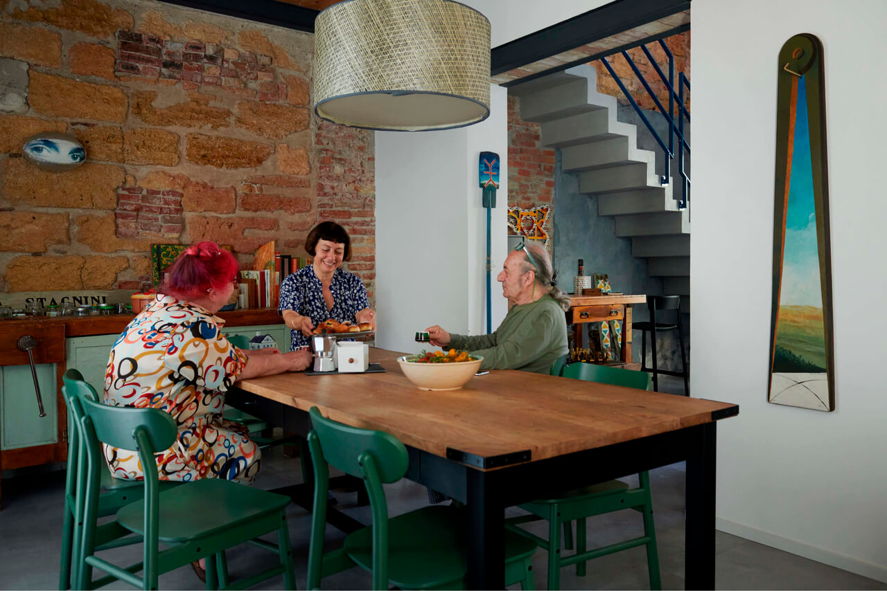 Three people sitting in the dining room