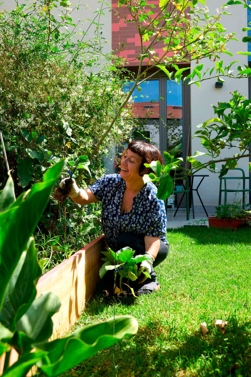 Woman standing in the green garden