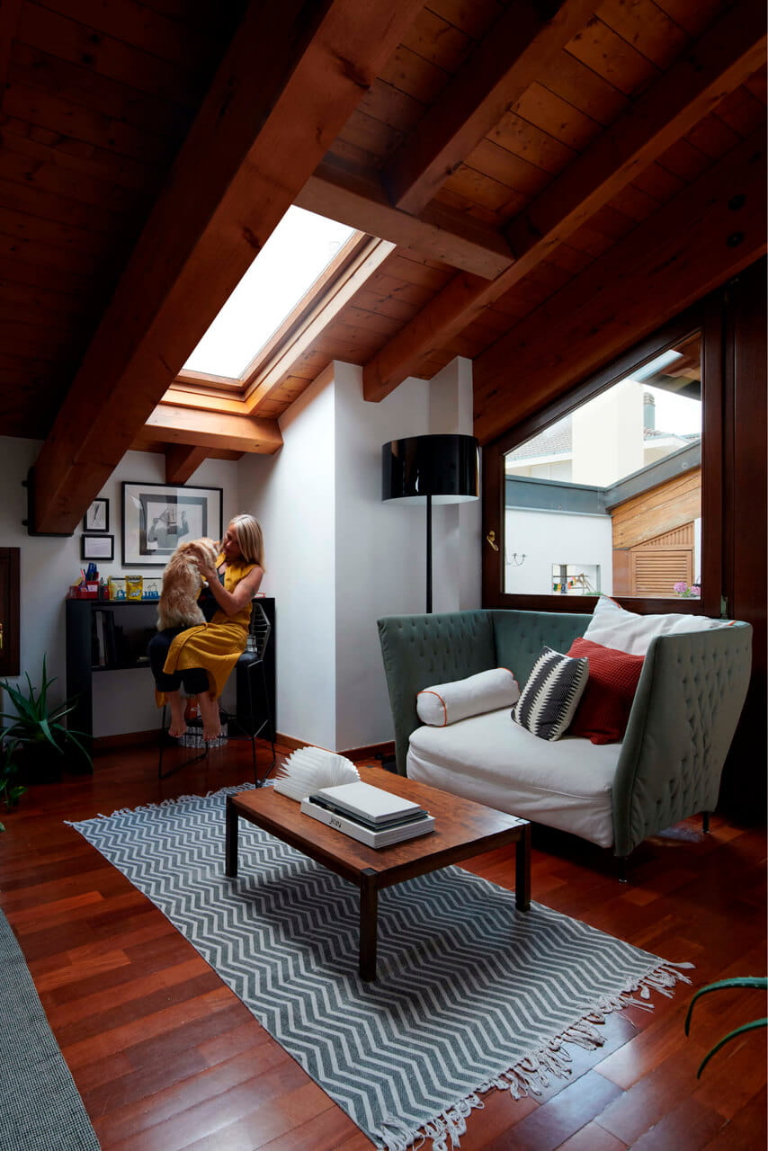 Living room with sofa and table and a roof window