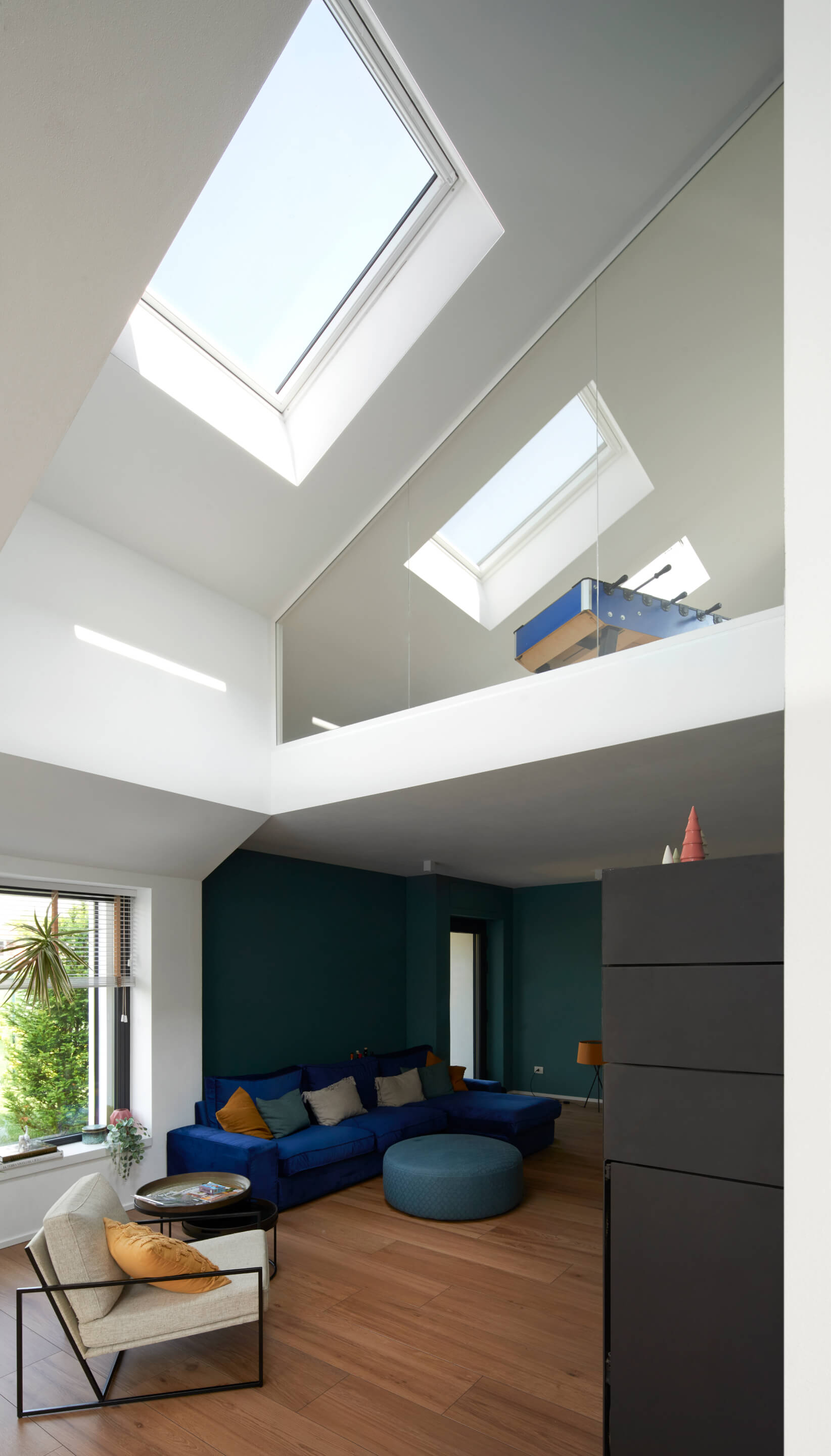 Attic and living room with roof windows