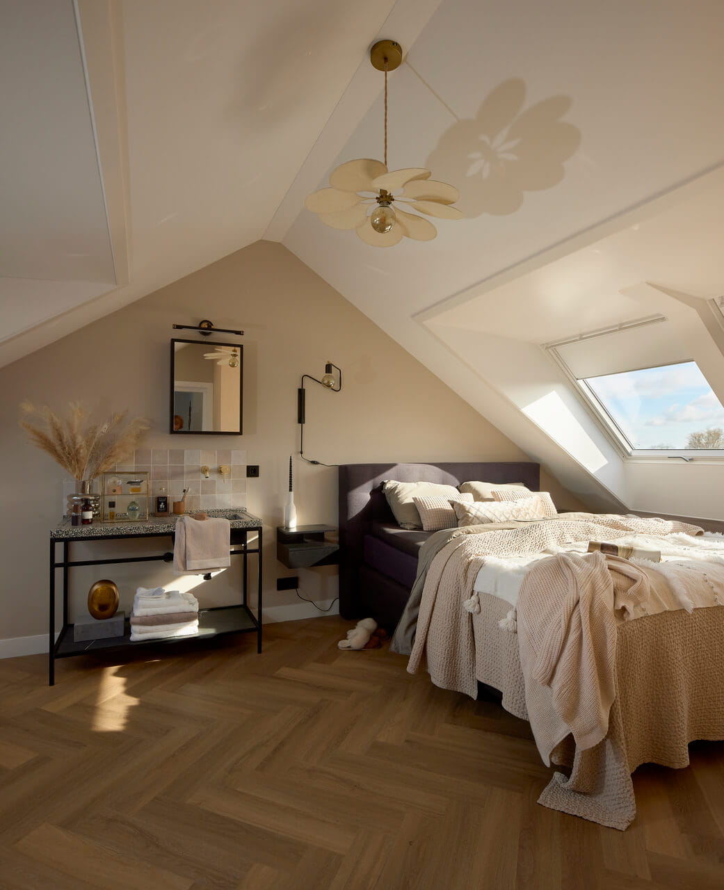 Bedroom in the attic with roof windows.